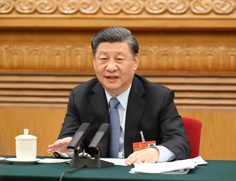 Chủ tịch Trung Quốc Tập Cận Bình tham gia thảo luận với các đại biểu từ đoàn đại biểu tỉnh Giang Tô, tại kỳ họp thứ nhất của Đại hội đại biểu nhân dân toàn quốc lần thứ 14. Ảnh: Xinhua